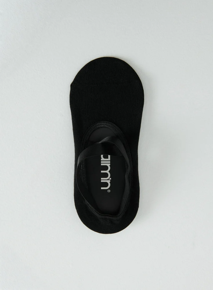 Zwarte Aim'n pilates sokken met witte logo en anti-slip zool