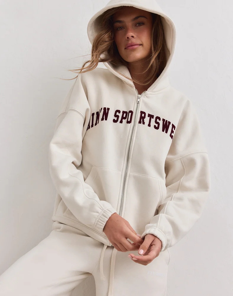 Aim'n Cream Varsity Sweat Zip Hood 26081529-050 dames vest met rits en capuchon in de kleur Cream crème met Varsity logo