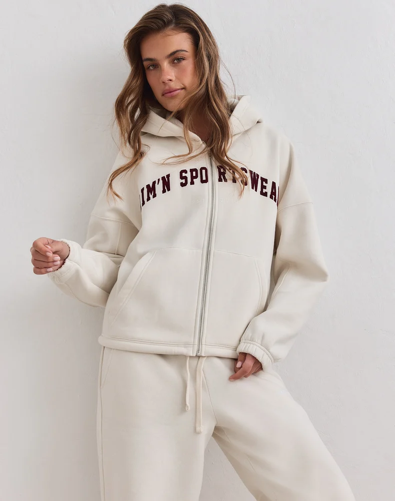 Aim'n Cream Varsity Sweat Zip Hood 26081529-050 dames vest met rits en capuchon in de kleur Cream crème met Varsity logo