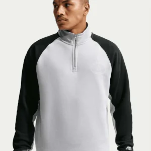 Comfortabele trui met een opstaande kraag en een halve ritssluiting (half-zip).