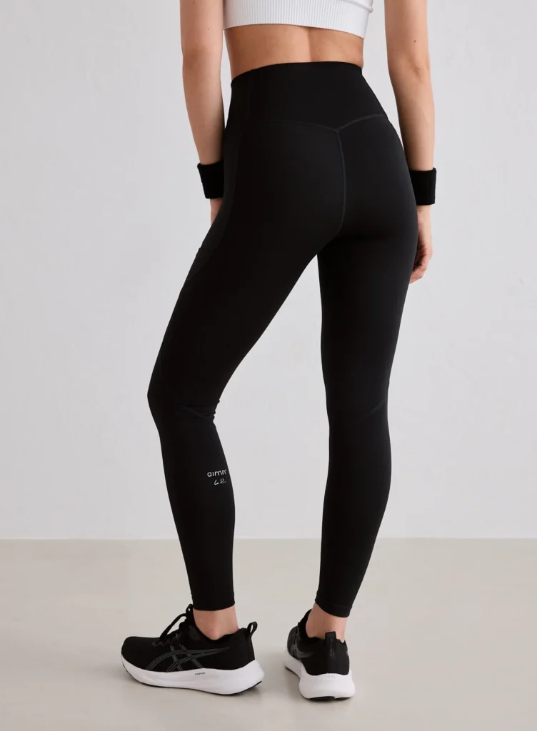 Aim'n Black Running Tights comfortabele en ondersteunende zwarte dames hardlooptight